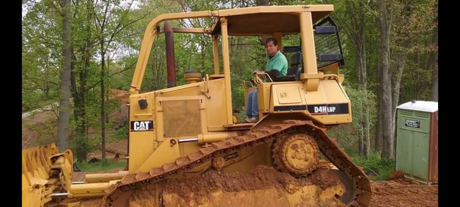 CAT D4H LGP bulldozer preparing a wooded site