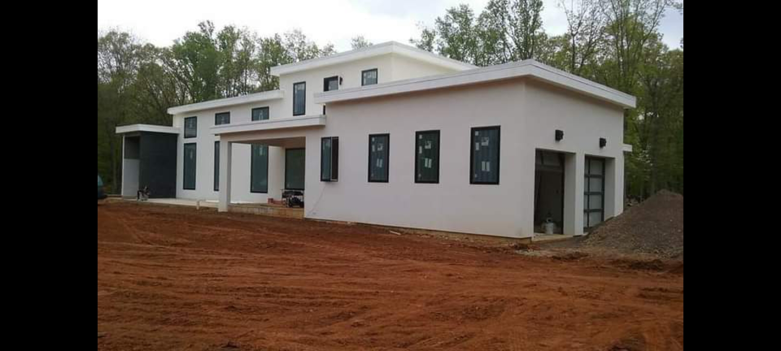 Modern white residential build with flat roof